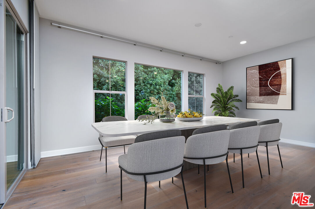 14608 McCormick Street Sherman Oaks, CA 91411 - Photo 10 of 29 a dining room with furniture window and wooden floor