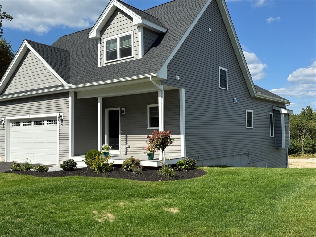 6 Chickadee Way, Unit 23 Upton, MA 01568 - Photo 1 of 40 a front view of a house with a garden and yard