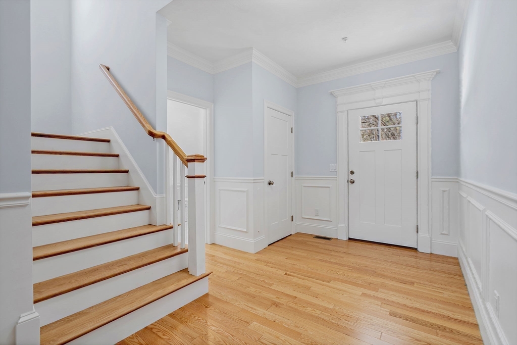 6 Chickadee Way, Unit 23 Upton, MA 01568 - Photo 28 of 41 a view of entryway with wooden floor