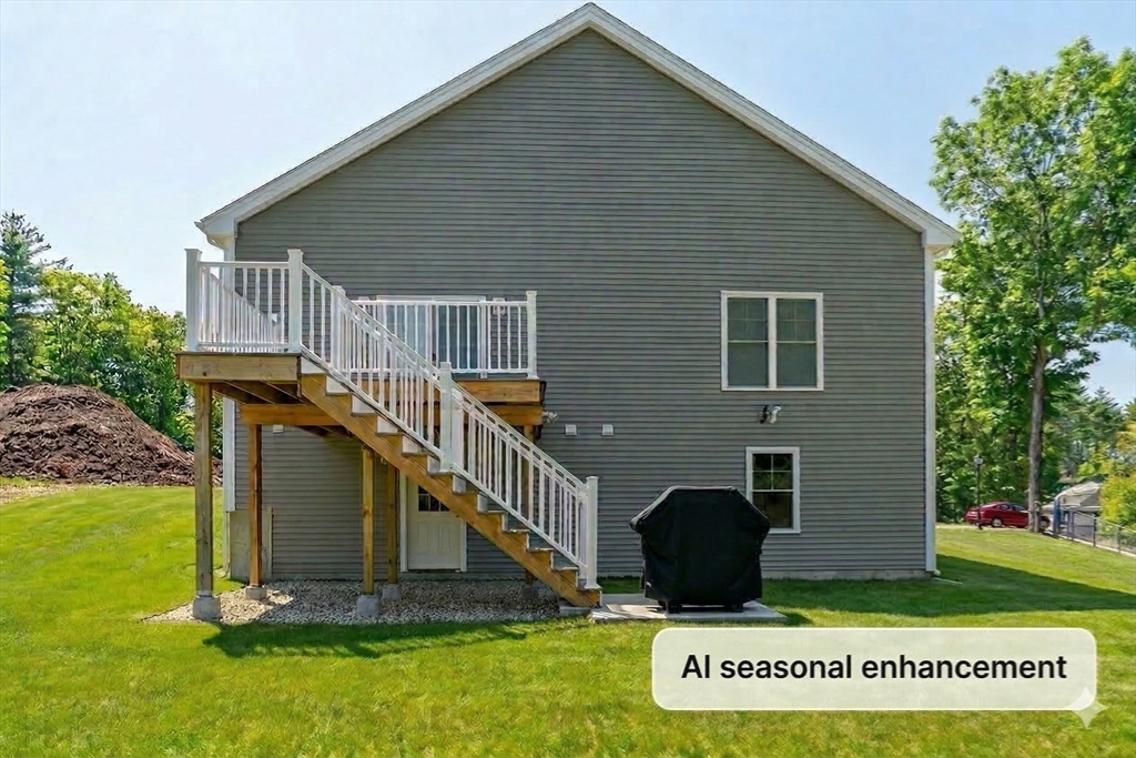 6 Chickadee Way, Unit 23 Upton, MA 01568 - Photo 38 of 40 a view of backyard with deck and garden