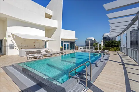 a view of a patio with table and chairs with wooden floor and fence