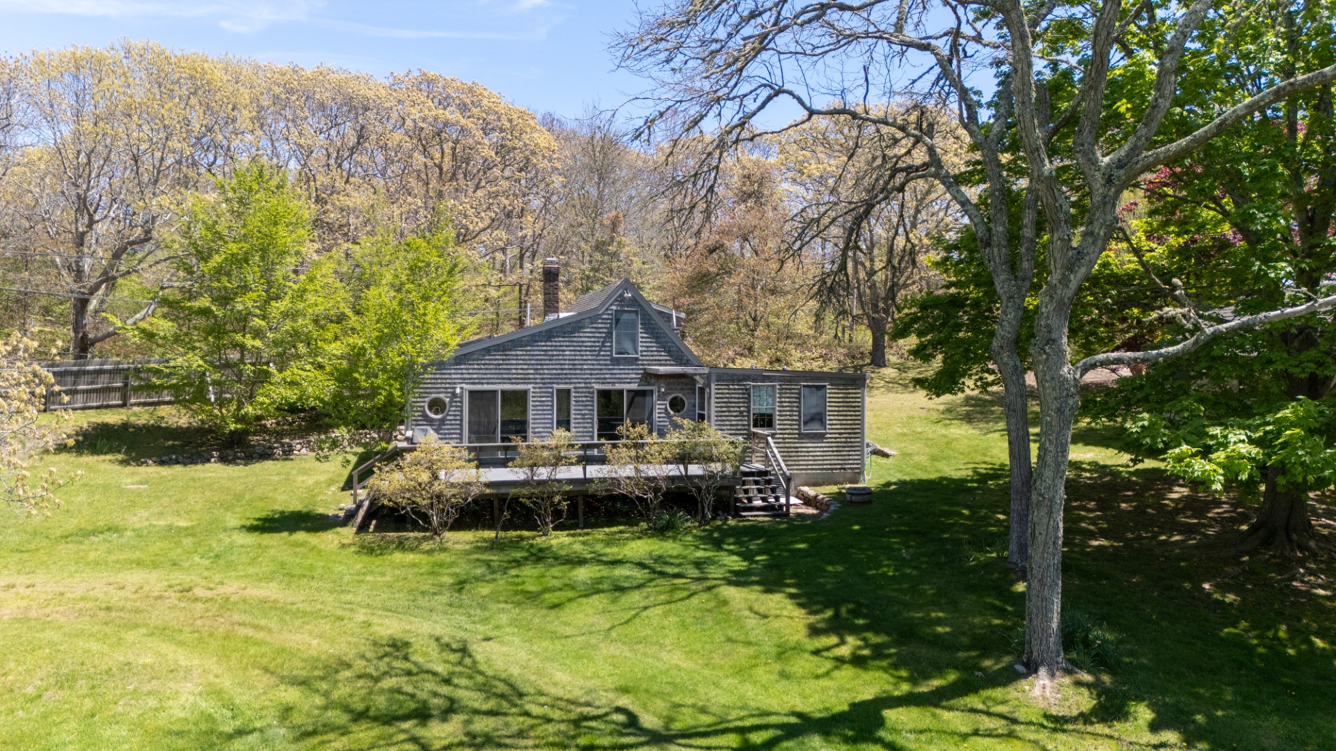 10 Abel's Neck Road Chilmark, MA 02535 - Photo 16 of 20 a front view of a house with yard and green space