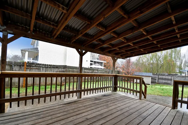 a view of porch with wooden floor