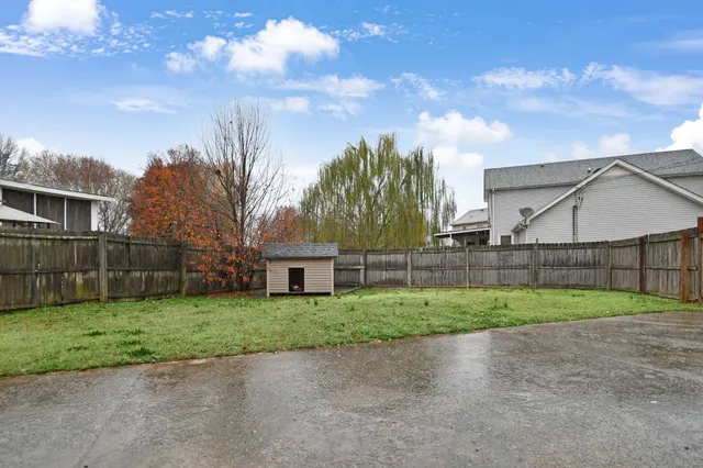 a view of a backyard of the house