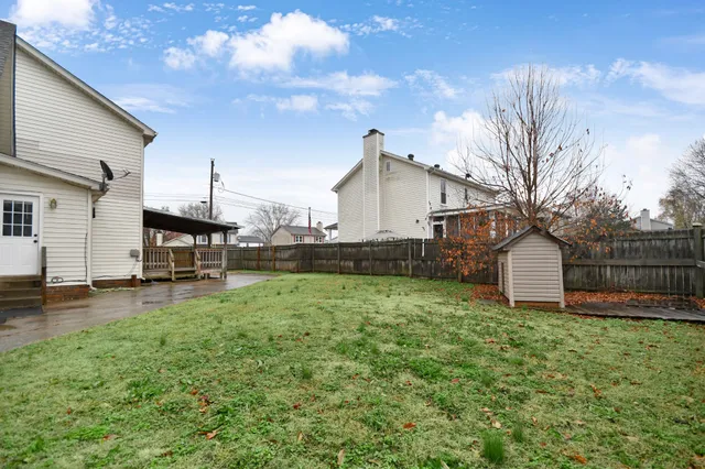 a view of a house with a back yard