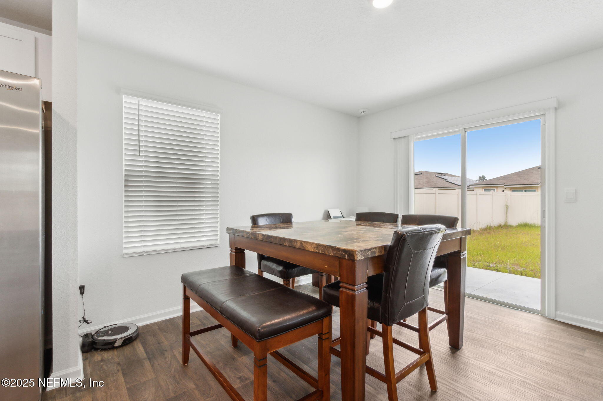 12647 European Beech Road Jacksonville, FL 32218 - Photo 12 of 28 a view of a dining room with furniture and window