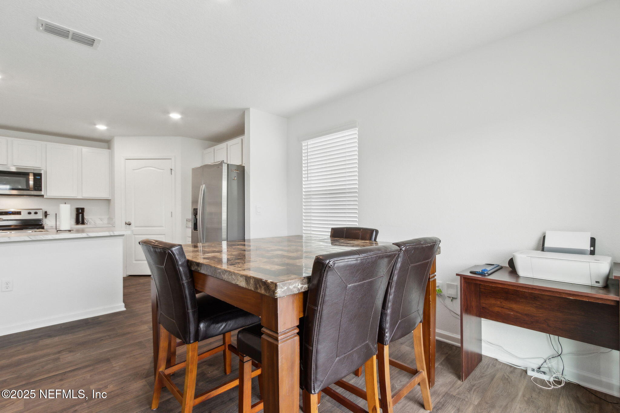 12647 European Beech Road Jacksonville, FL 32218 - Photo 14 of 28 a view of a dining room with furniture