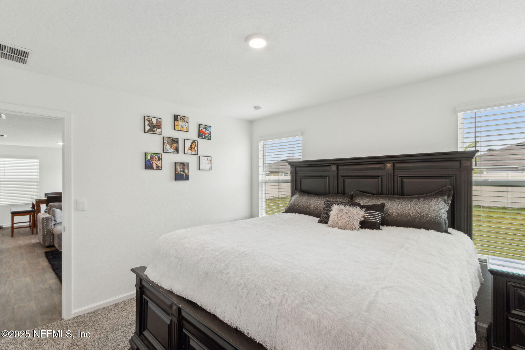 12647 European Beech Road Jacksonville, FL 32218 - Photo 16 of 28 a bedroom with a bed and wall painting