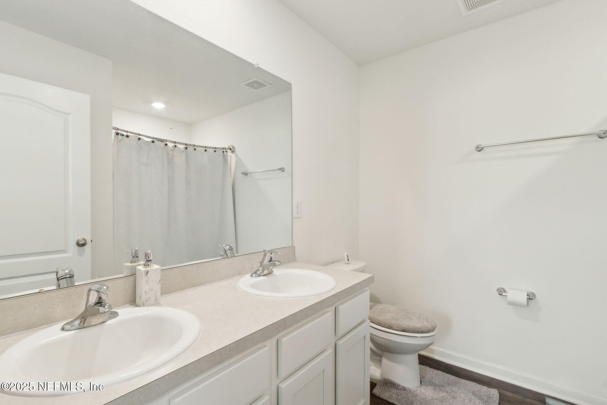 12647 European Beech Road Jacksonville, FL 32218 - Photo 18 of 28 a bathroom with a sink toilet and a mirror