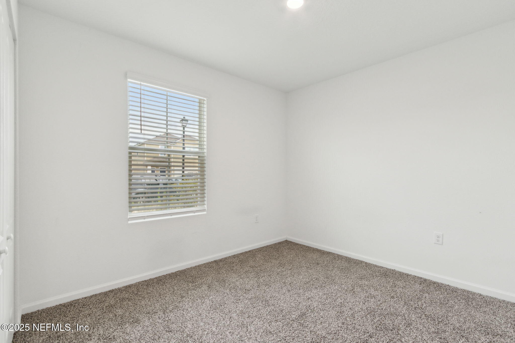 12647 European Beech Road Jacksonville, FL 32218 - Photo 19 of 28 an empty room with a window