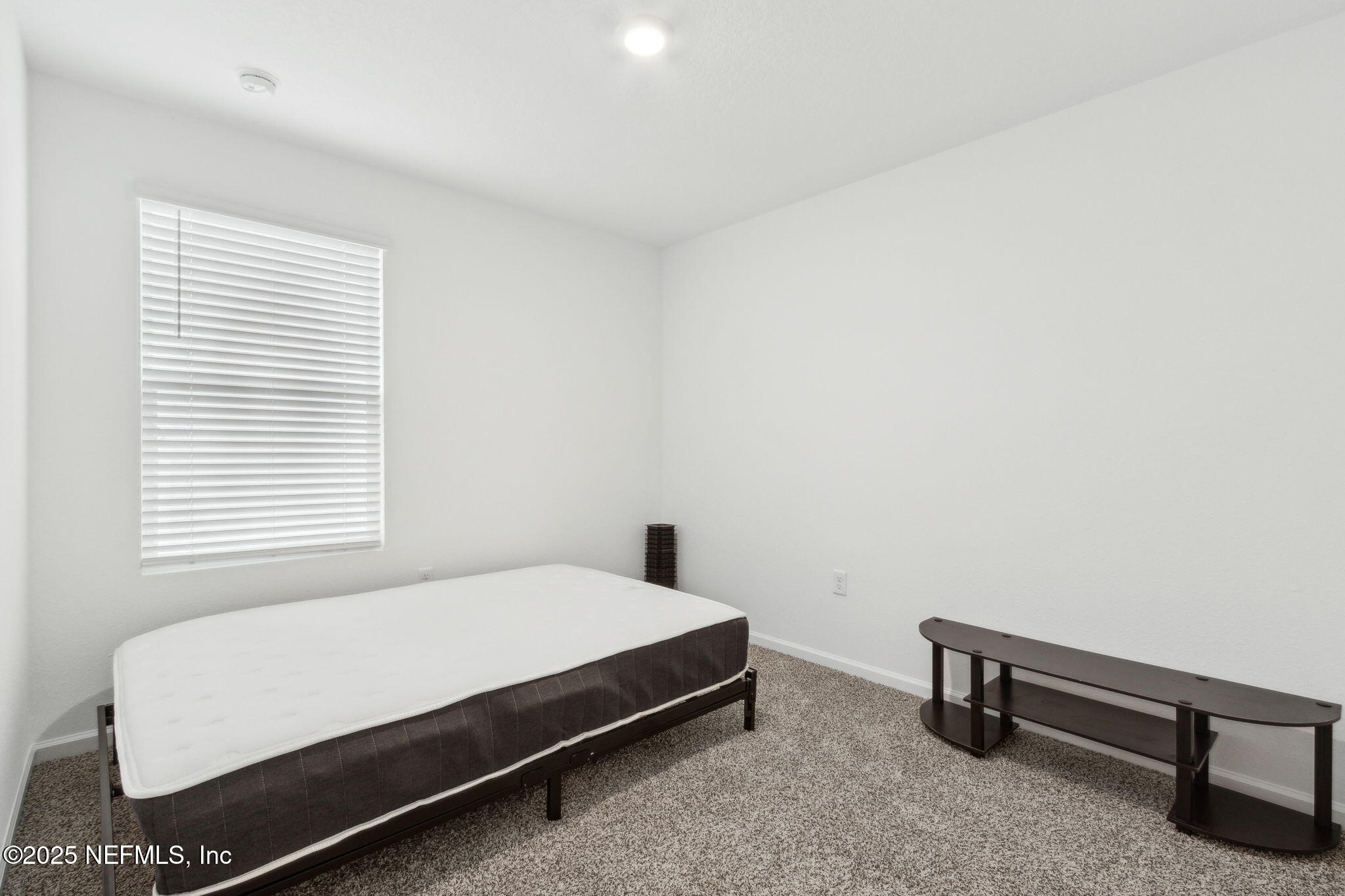 12647 European Beech Road Jacksonville, FL 32218 - Photo 23 of 28 a bedroom with a bed and a window