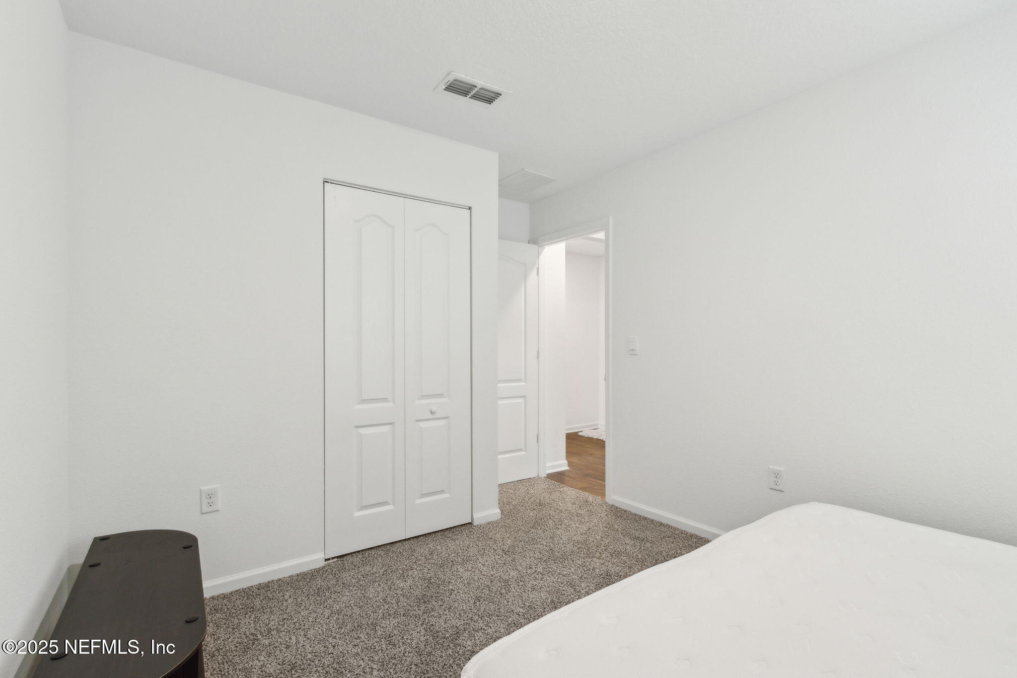 12647 European Beech Road Jacksonville, FL 32218 - Photo 24 of 28 a bedroom with a bed and a rug