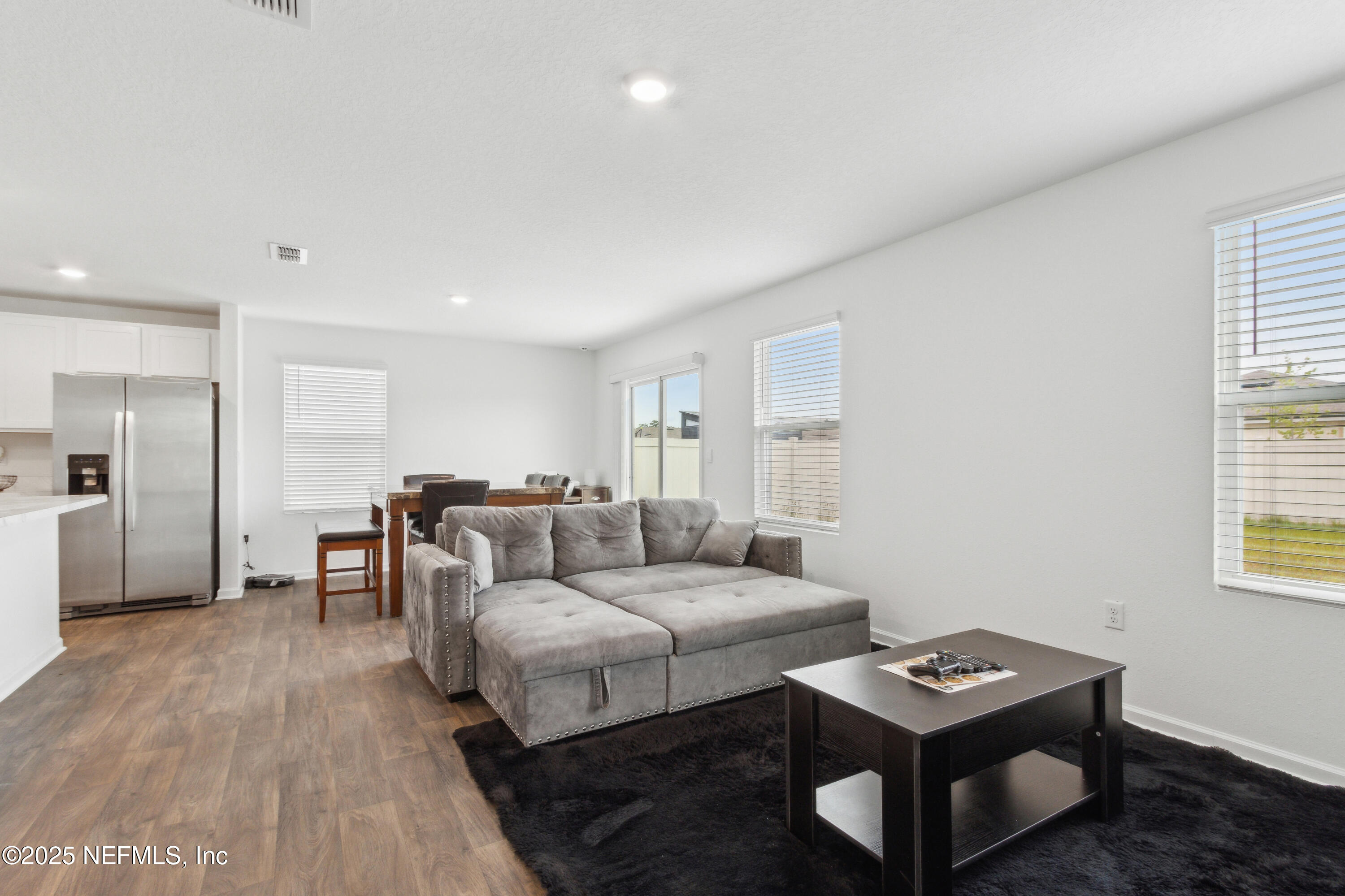 12647 European Beech Road Jacksonville, FL 32218 - Photo 5 of 28 a living room with furniture and a wooden floor