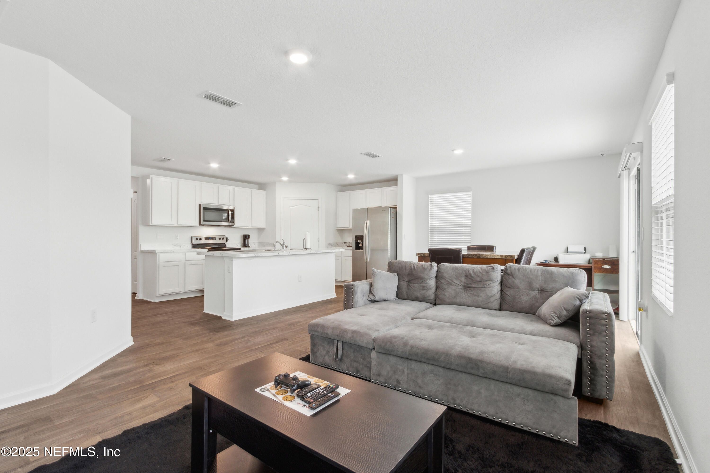 12647 European Beech Road Jacksonville, FL 32218 - Photo 6 of 28 a living room with furniture and view of kitchen