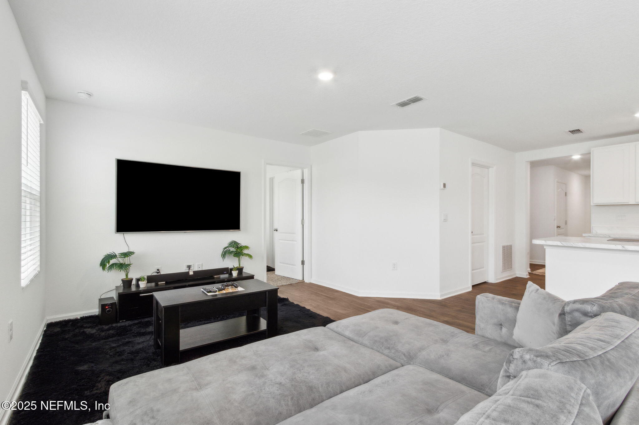 12647 European Beech Road Jacksonville, FL 32218 - Photo 7 of 28 a living room with furniture and a flat screen tv