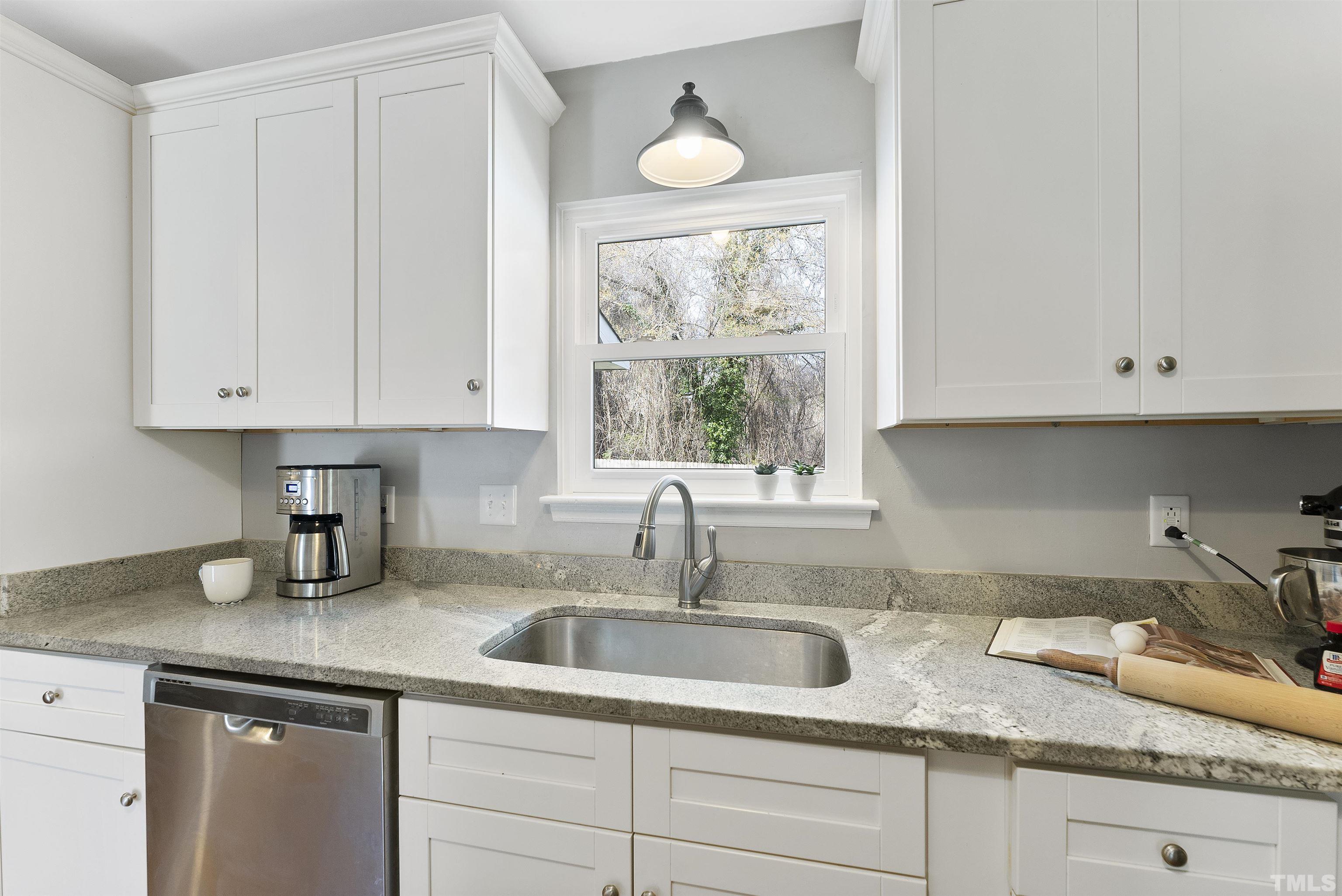 5413 Old Towne Road Raleigh, NC 27612 - Photo 17 of 34 a kitchen with granite countertop white cabinets white appliances and a sink