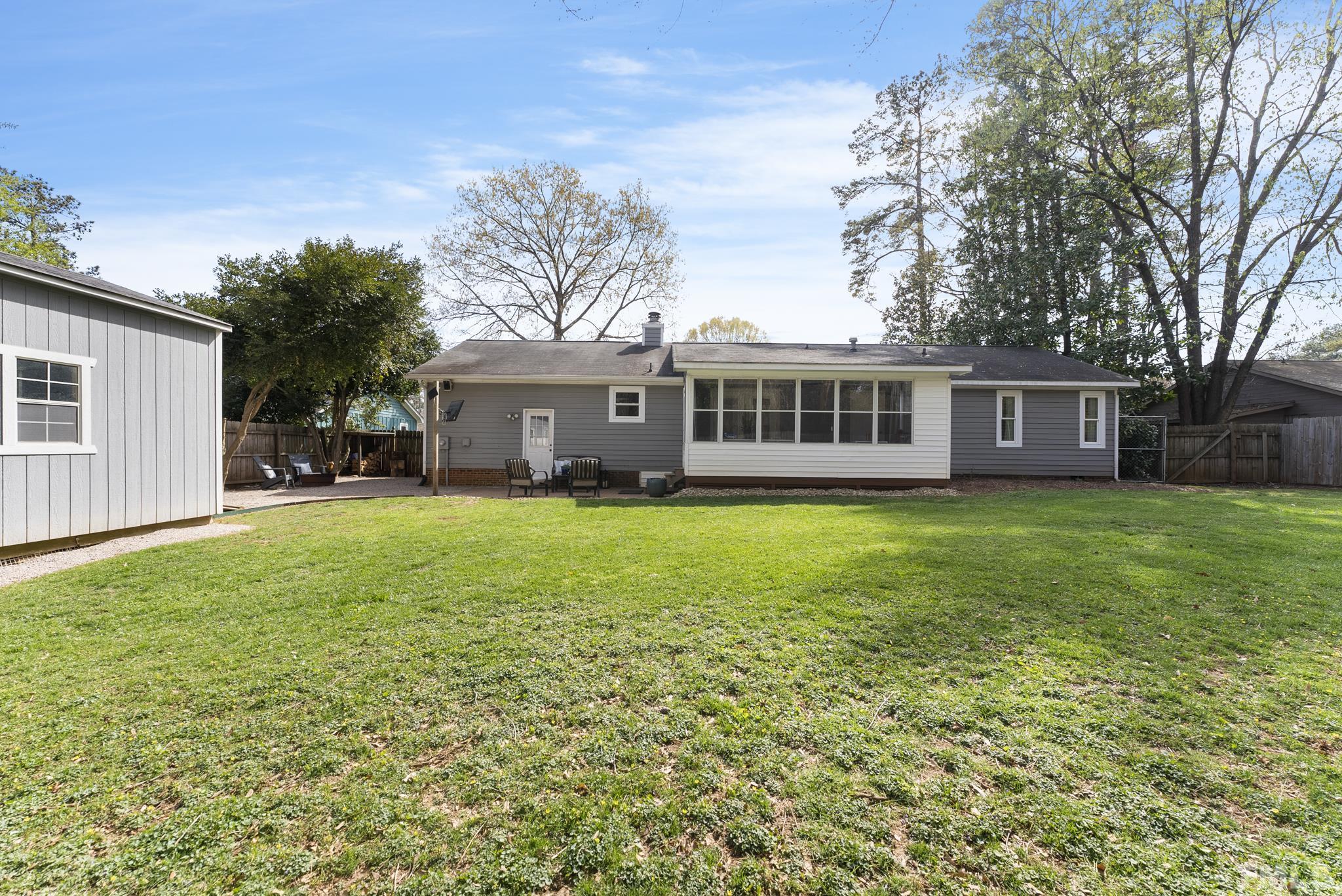 5413 Old Towne Road Raleigh, NC 27612 - Photo 32 of 34 a view of a house with a backyard and a patio