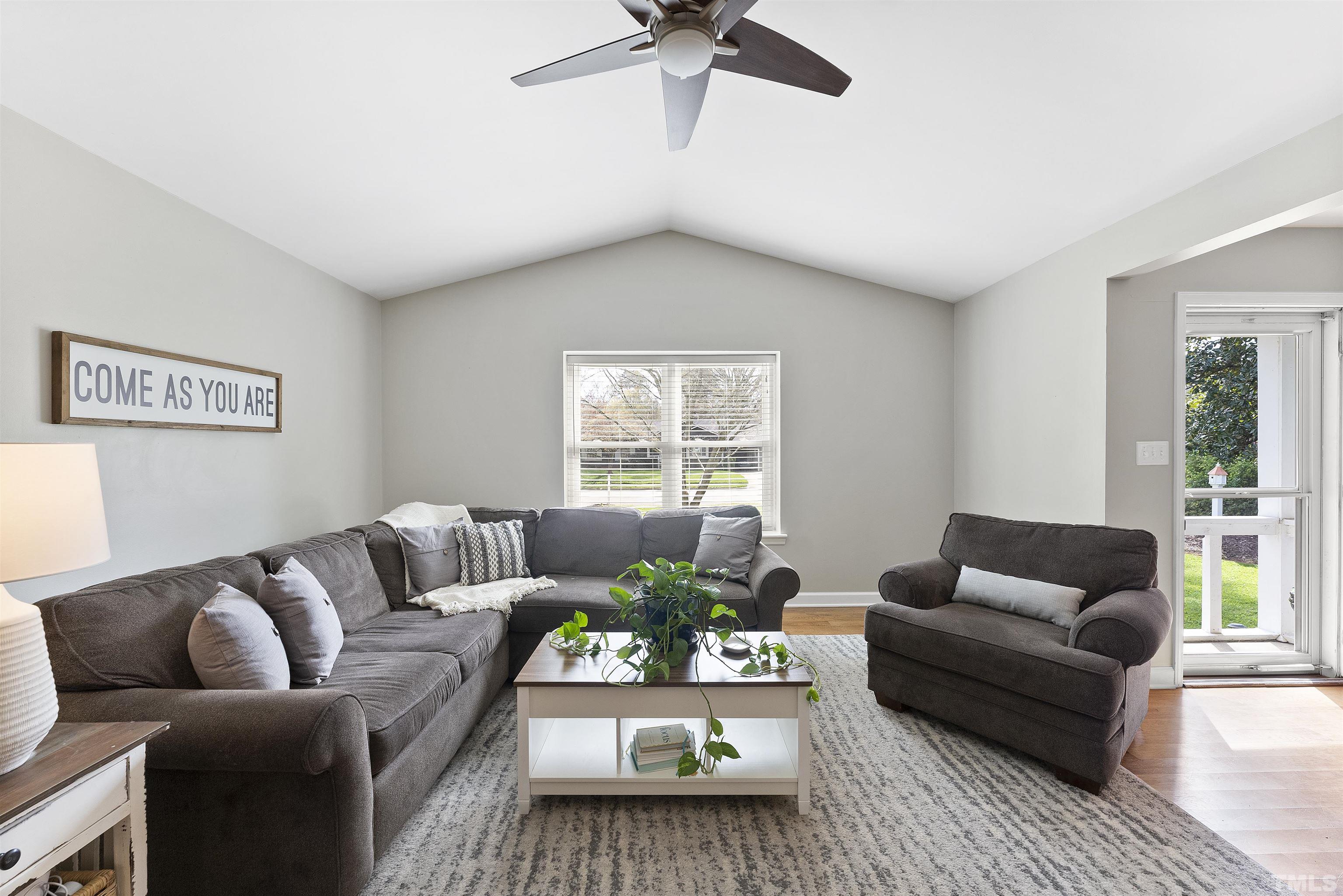 5413 Old Towne Road Raleigh, NC 27612 - Photo 6 of 34 a living room with furniture and a large window