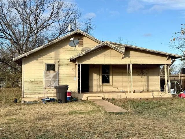 a front view of a house with garage