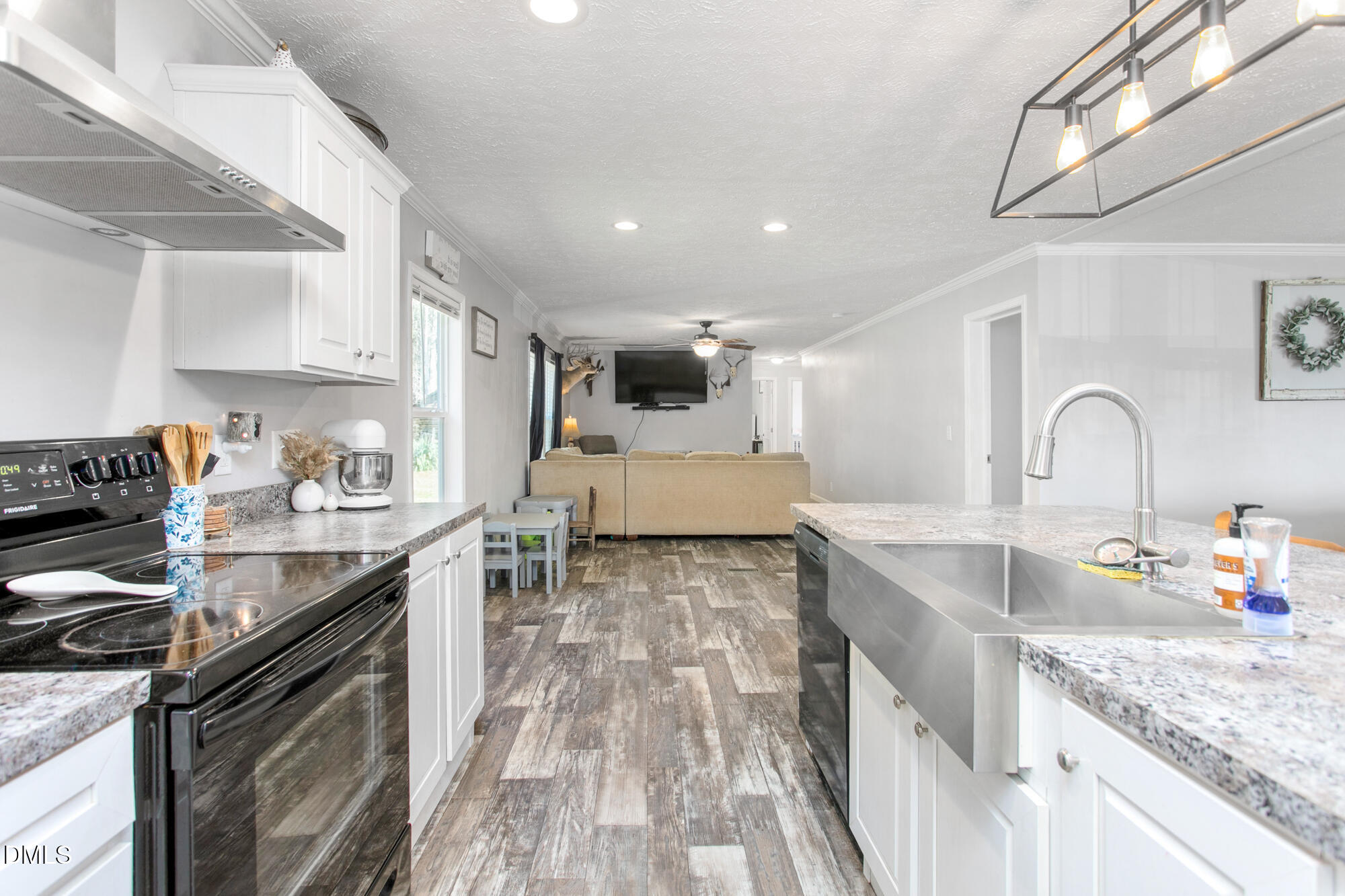 578 Brintle Road Reidsville, NC 27320 - Photo 11 of 37 a kitchen with stainless steel appliances granite countertop a sink stove and cabinets