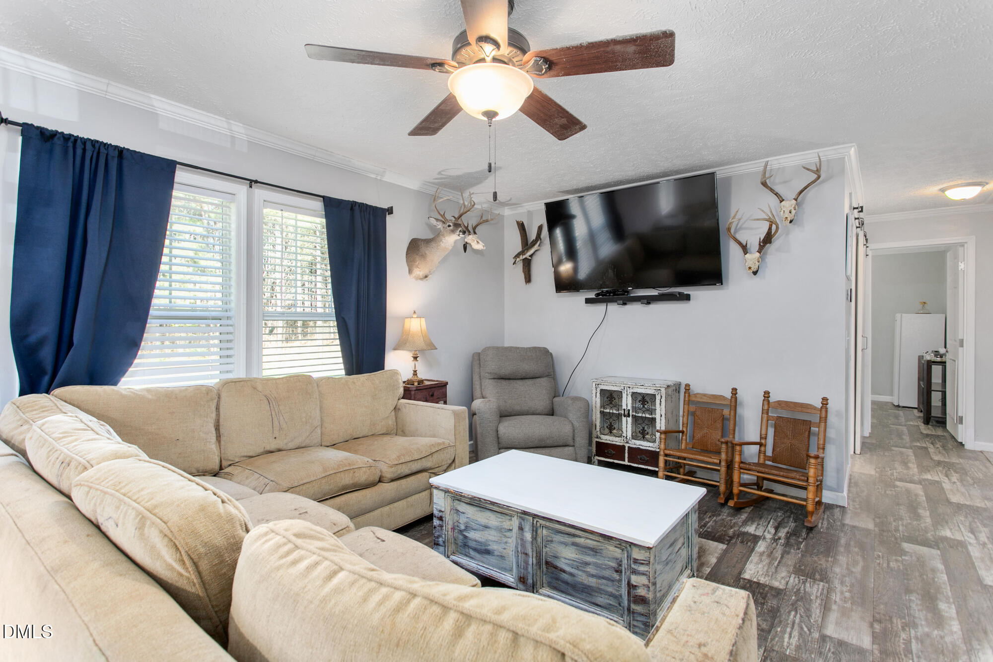 578 Brintle Road Reidsville, NC 27320 - Photo 13 of 37 a living room with furniture a flat screen tv and a window