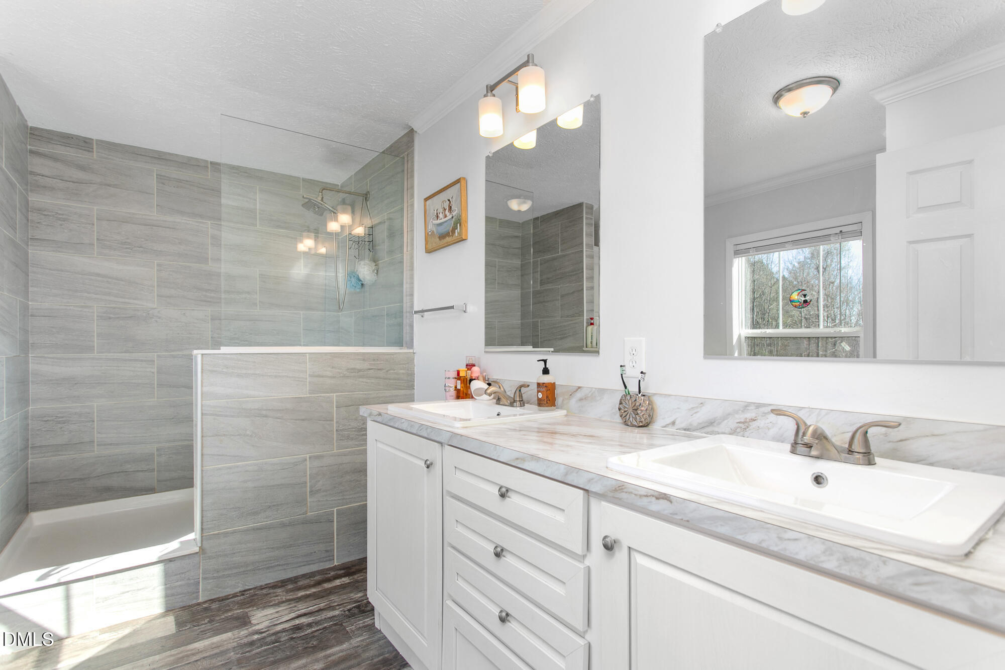 578 Brintle Road Reidsville, NC 27320 - Photo 16 of 37 a bathroom with a double vanity sink mirror and shower