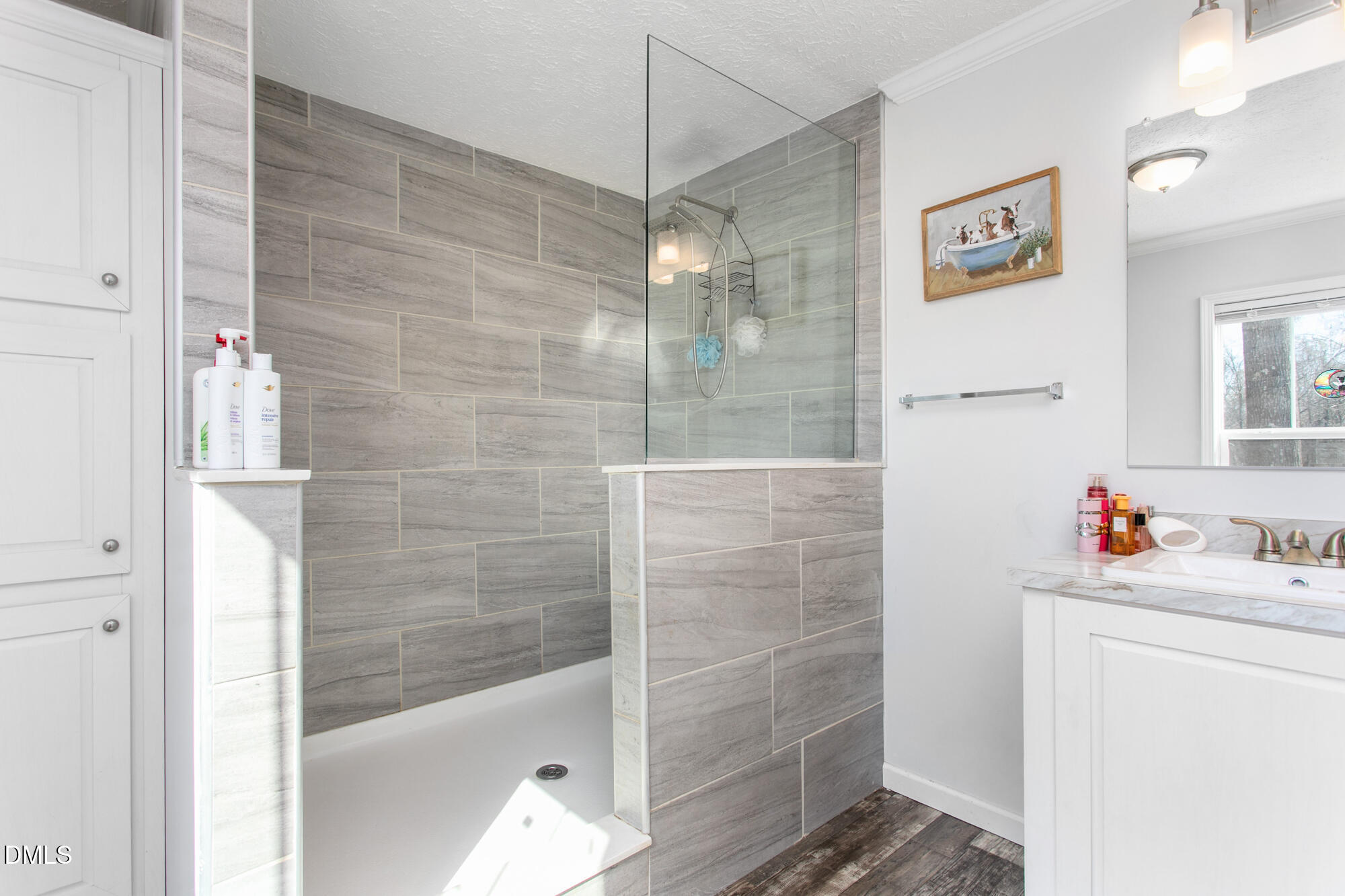 578 Brintle Road Reidsville, NC 27320 - Photo 17 of 37 a bathroom with a shower sink and a mirror