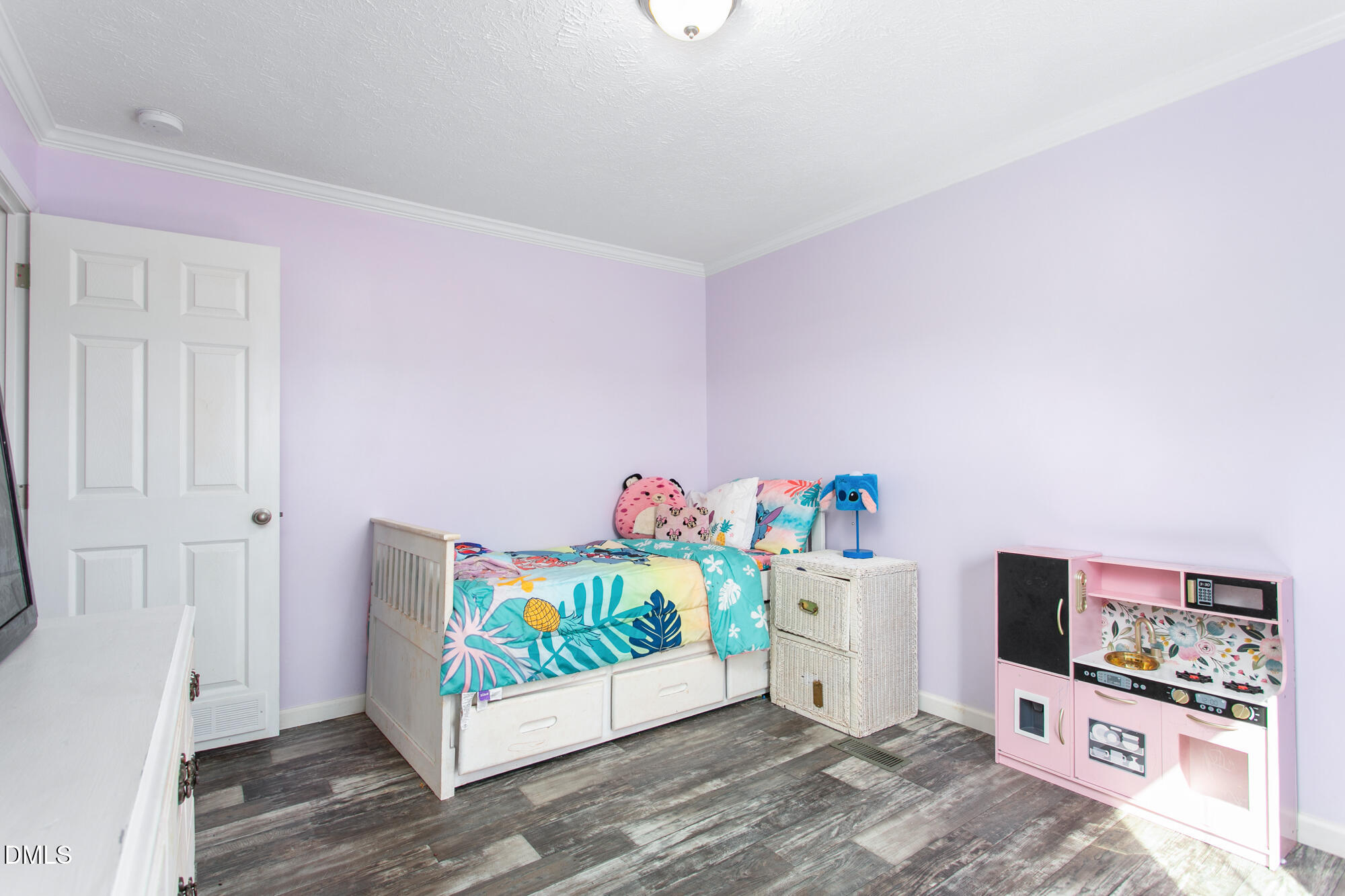 578 Brintle Road Reidsville, NC 27320 - Photo 26 of 37 a bedroom with bed and wooden floor