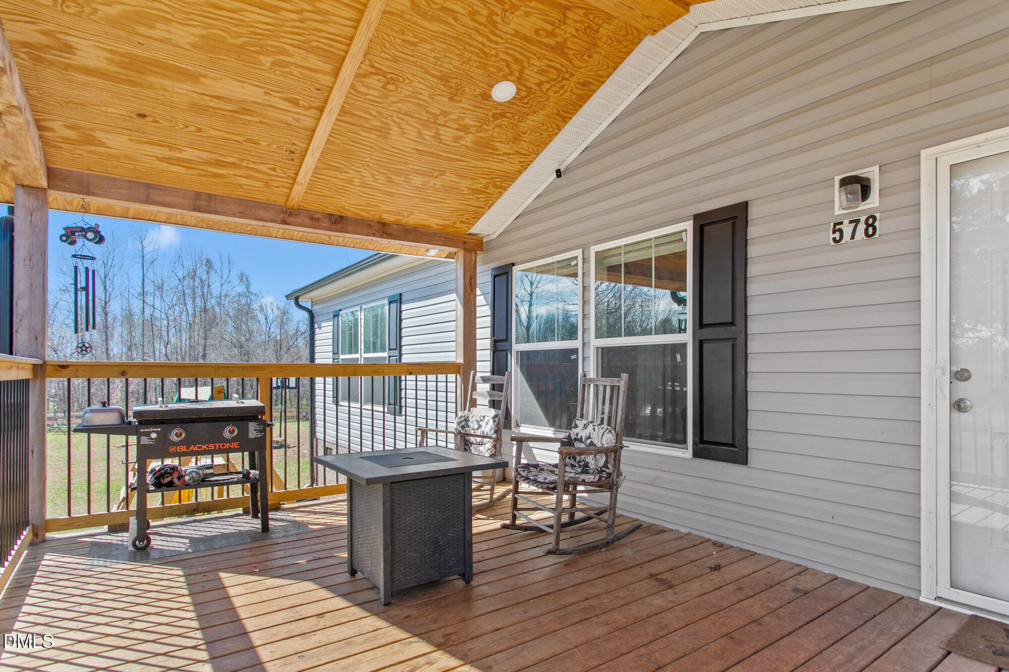 578 Brintle Road Reidsville, NC 27320 - Photo 4 of 37 a view of a patio with table and chairs with wooden floor and fence