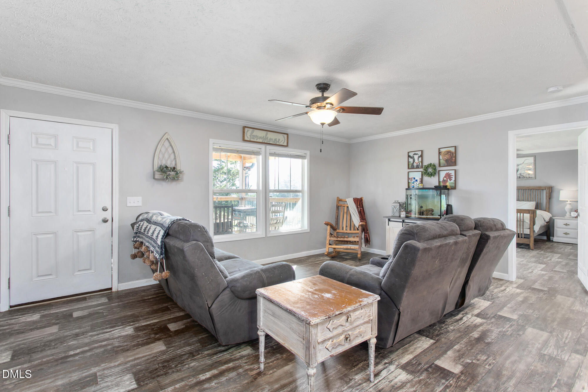 578 Brintle Road Reidsville, NC 27320 - Photo 6 of 37 a living room with furniture two window and a wooden floor