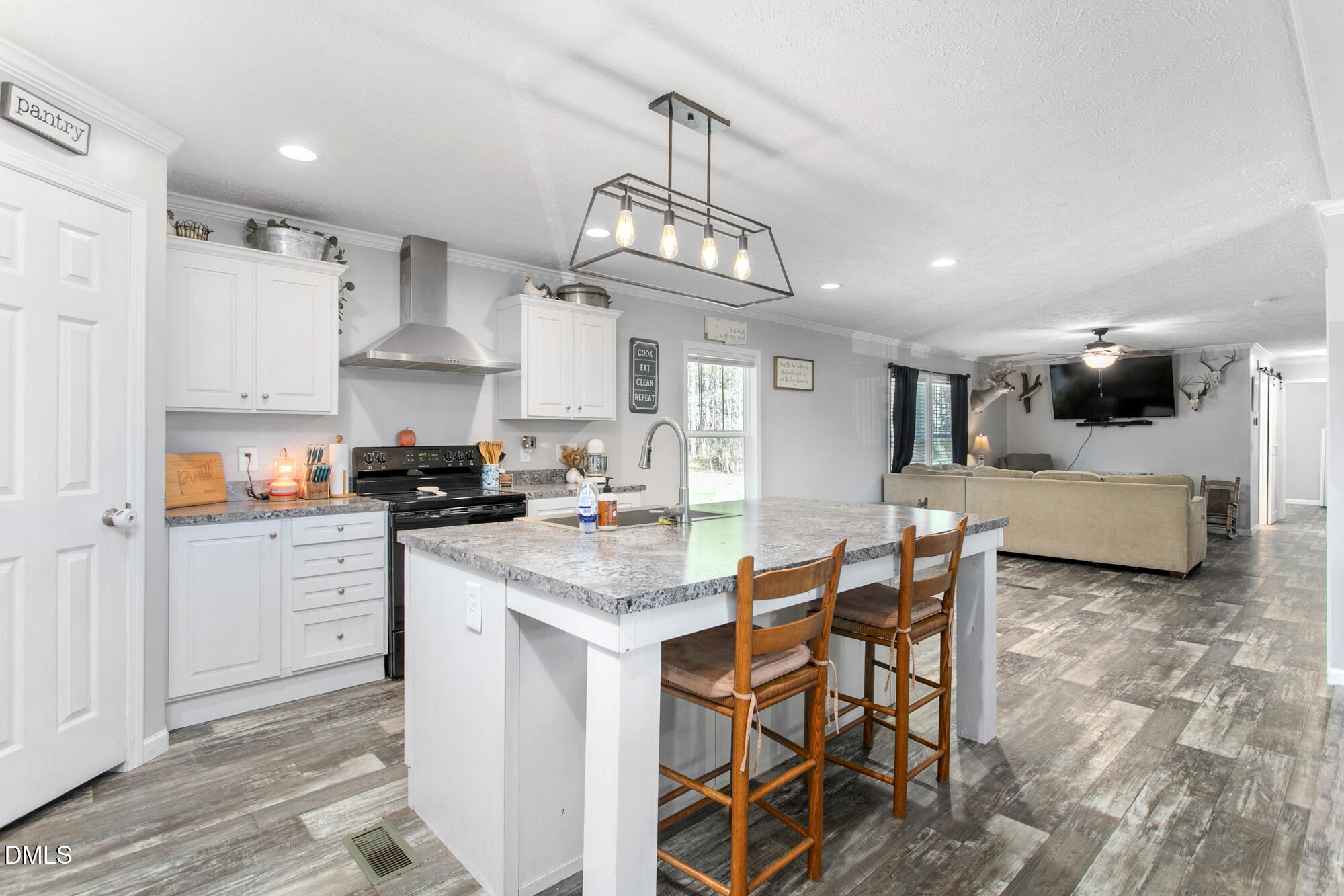 578 Brintle Road Reidsville, NC 27320 - Photo 8 of 37 a kitchen with stainless steel appliances kitchen island granite countertop a sink and cabinets