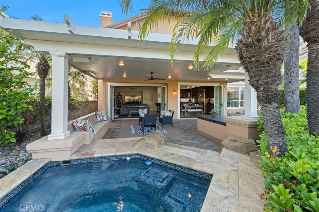 6 Beaconsfield Rancho Santa Margarita, CA 92679 - Photo 15 of 51 Folding glass doors in the family room and kitchen nook area, making an open space to beautiful backyard!