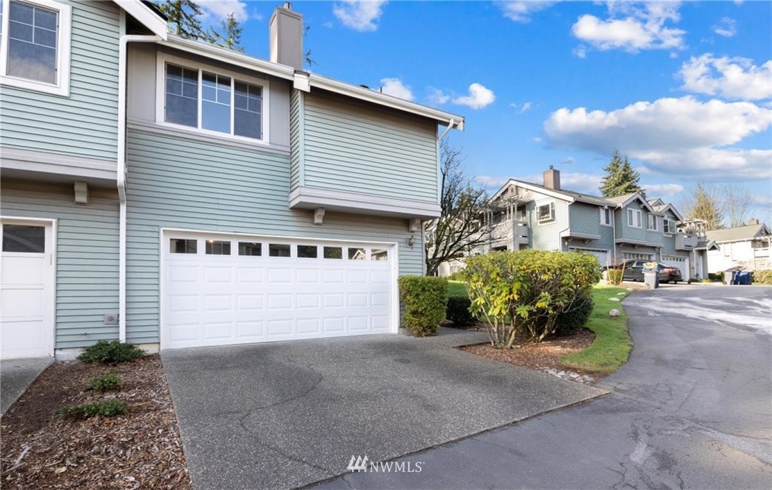 22709 4th Avenue West, Unit 105 Bothell, WA 98021 - Photo 1 of 32 a front view of a house with garden