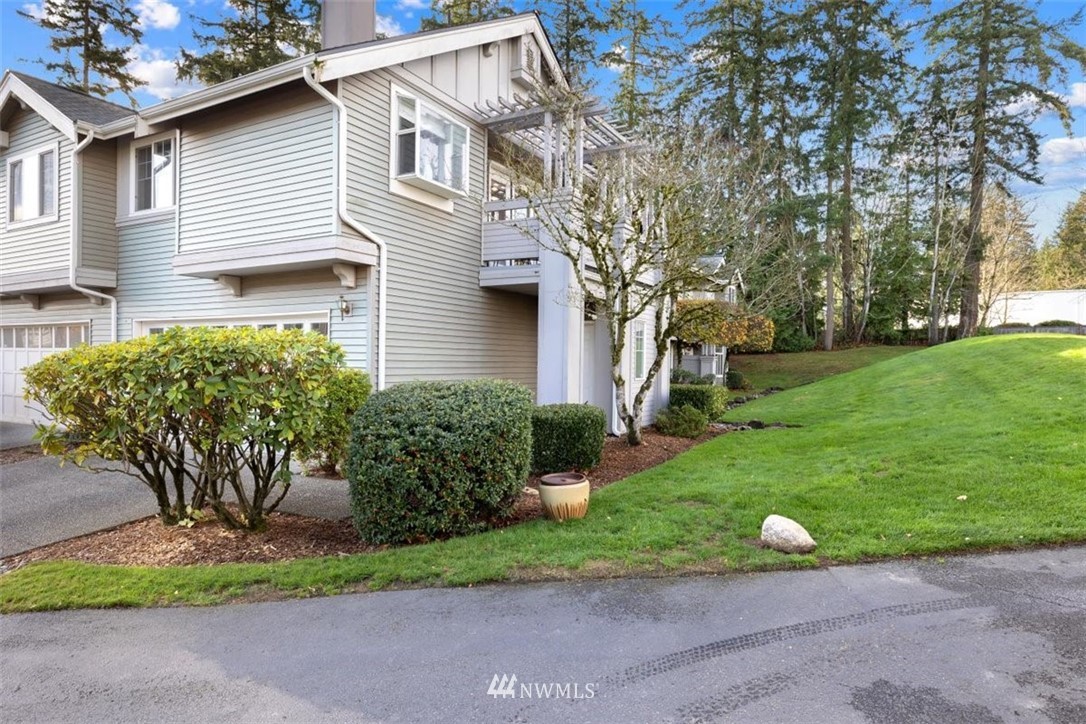 22709 4th Avenue West, Unit 105 Bothell, WA 98021 - Photo 2 of 32 a front view of a house with garden