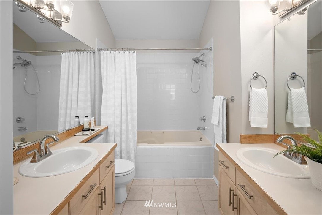 22709 4th Avenue West, Unit 105 Bothell, WA 98021 - Photo 23 of 32 a bathroom with a sink a toilet and a bathtub