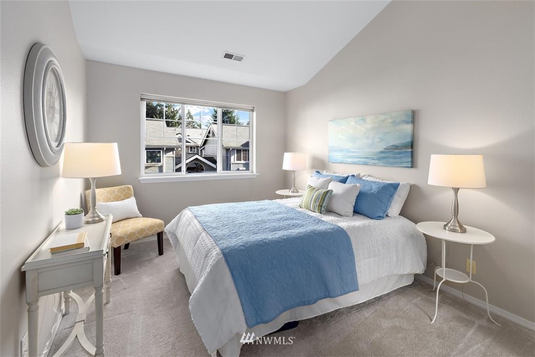 22709 4th Avenue West, Unit 105 Bothell, WA 98021 - Photo 25 of 32 a bedroom with a large bed and a window