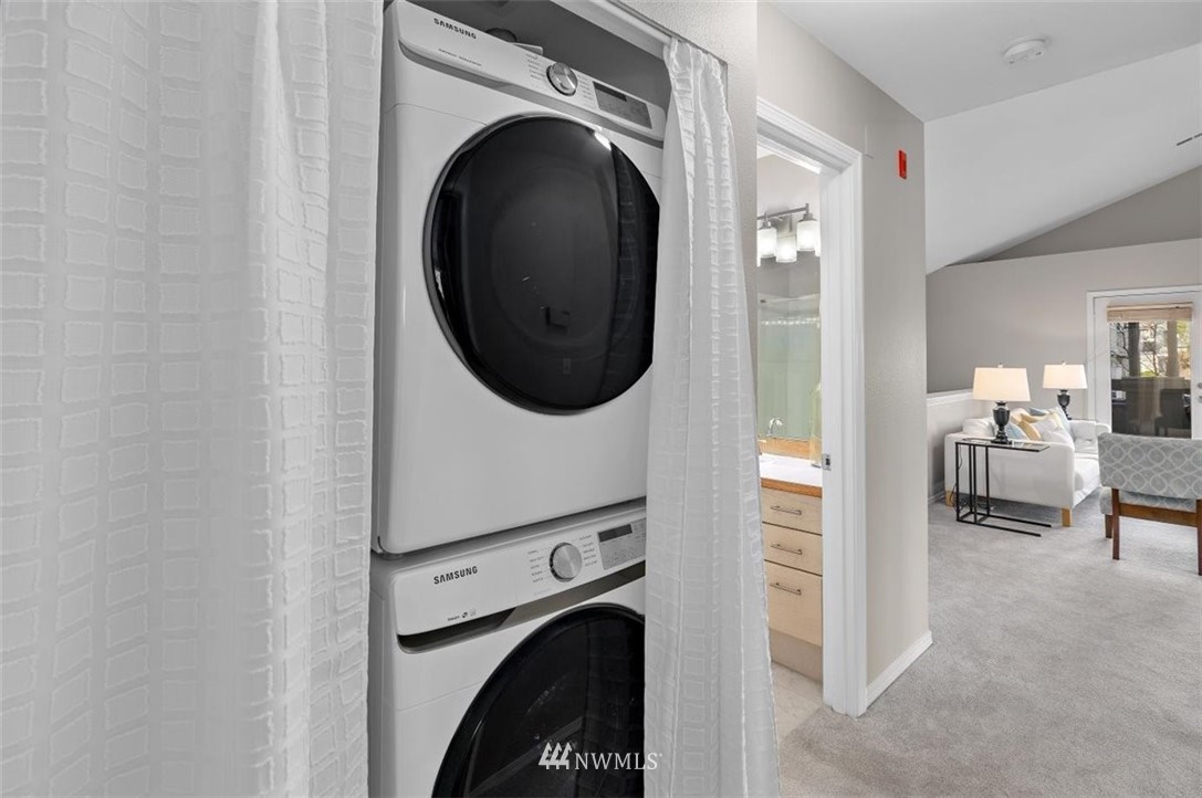 22709 4th Avenue West, Unit 105 Bothell, WA 98021 - Photo 28 of 32 a view of a hallway with washer and dryer