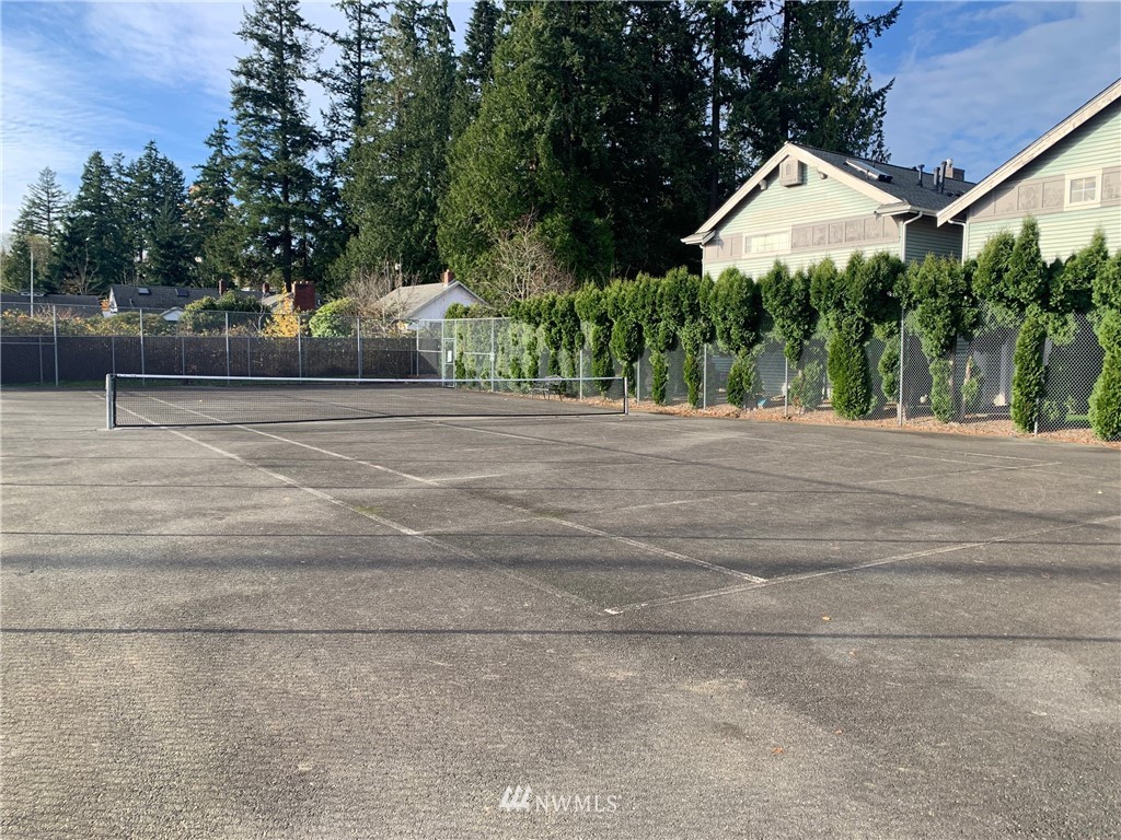 22709 4th Avenue West, Unit 105 Bothell, WA 98021 - Photo 32 of 32 a view of a house with a yard and a garage