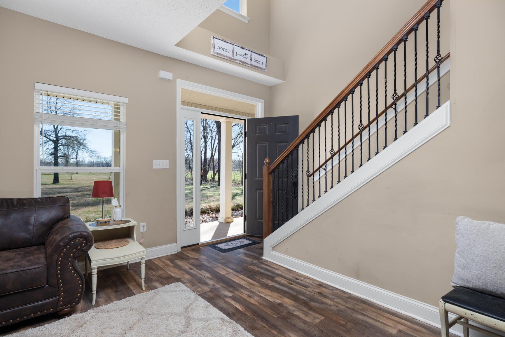 2844 Bud Eubank Road Stanton, TN 38069 - Photo 4 of 39 Foyer featuring dark wood-type flooring, a towering ceiling, baseboards, and stairway