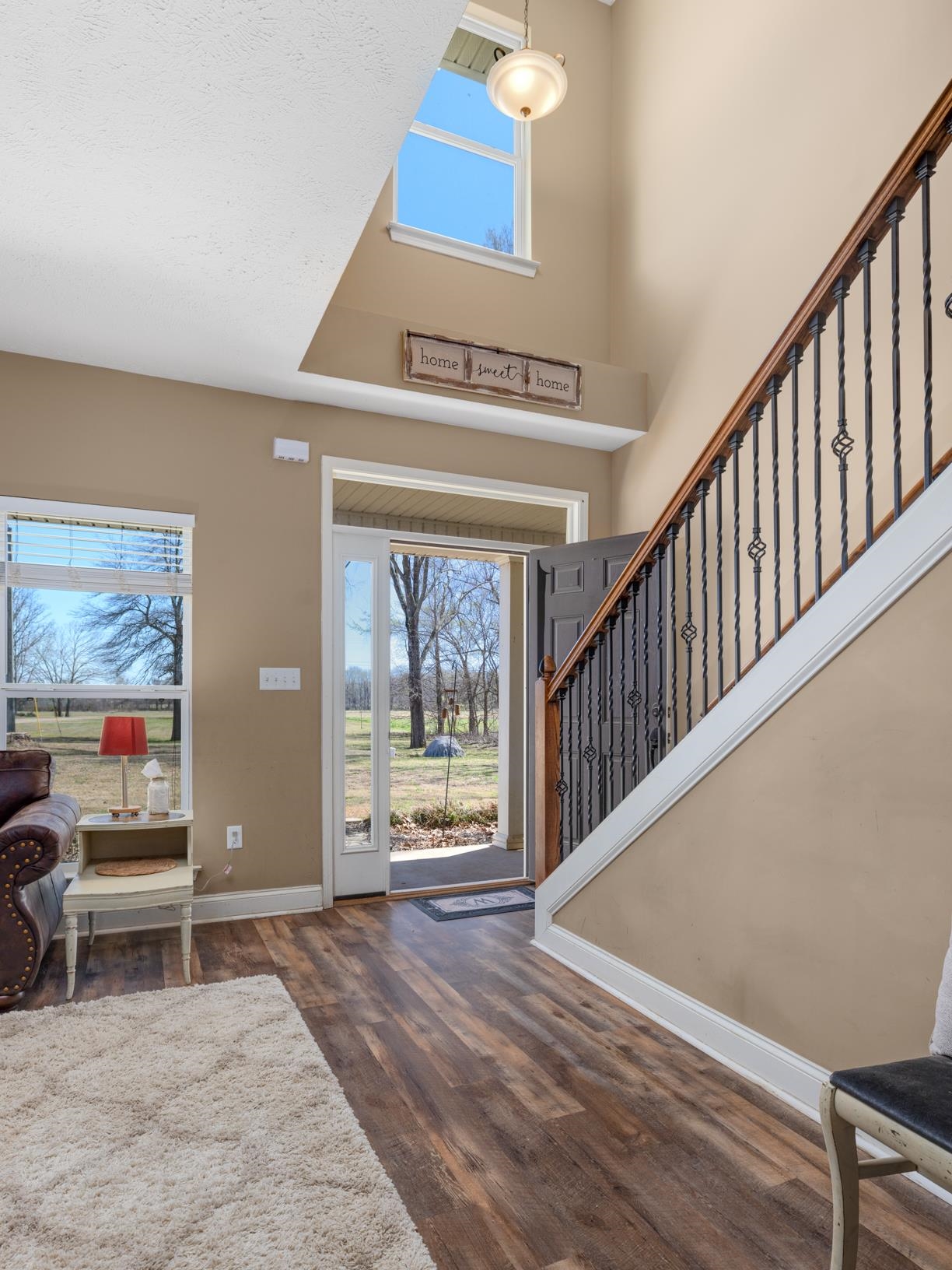 2844 Bud Eubank Road Stanton, TN 38069 - Photo 5 of 39 Foyer with a high ceiling, baseboards, stairway, and wood finished floors