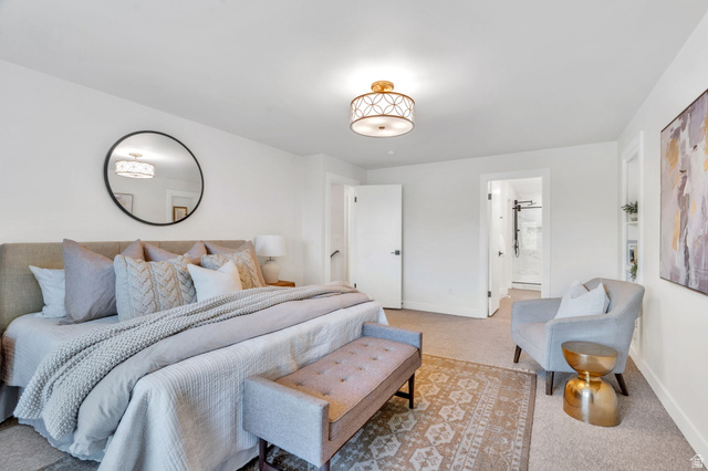 3813 North Foothill Drive Provo, UT 84604 - Photo 24 of 71 Spacious bedroom featuring carpet flooring, crisp white walls, and an ornate flush-mount ceiling light