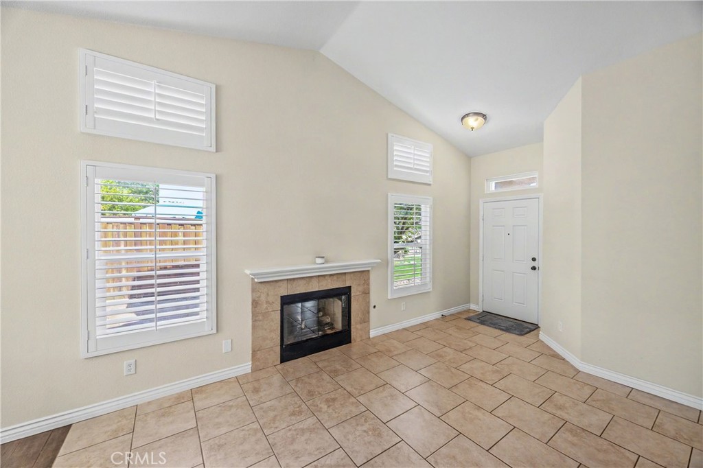 43121 Corte Cabrera Temecula, CA 92592 - Photo 4 of 17 a view of an empty room with window and fire place