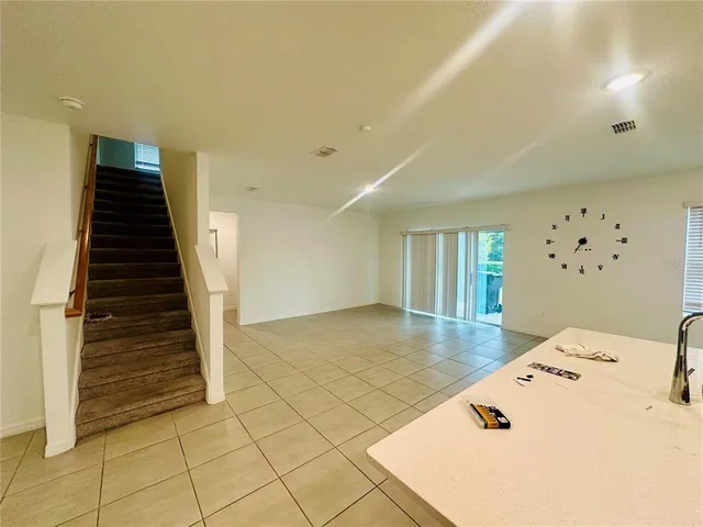 a view of an empty room and window