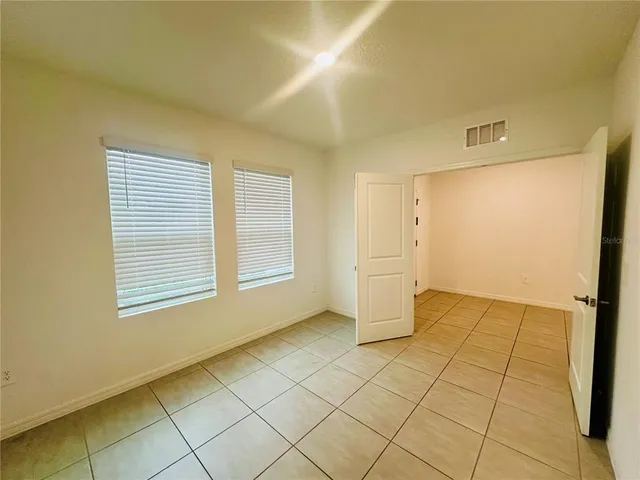 a room with a washing machine and a sink
