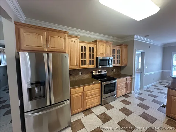 a view of a living room and kitchen