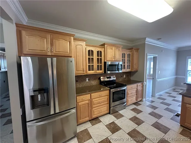 a view of a living room and kitchen