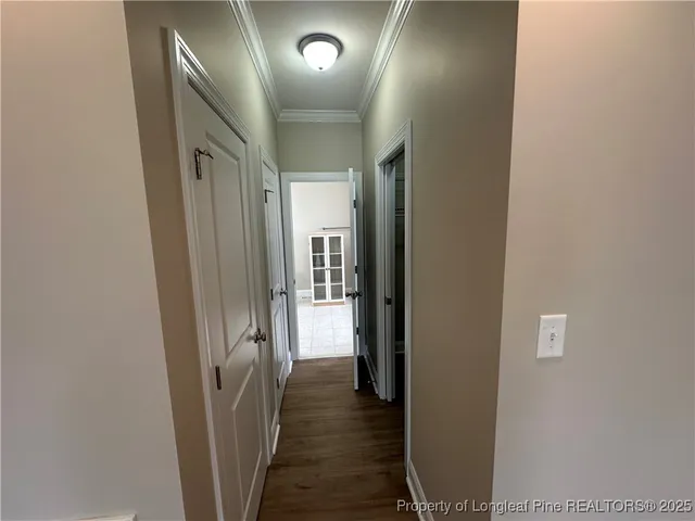 a view of storage and utility room with racks on the wall