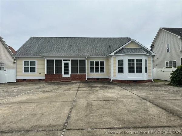 a bathroom with a black and white checkered floor