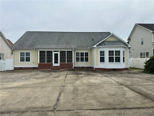 a bathroom with a black and white checkered floor