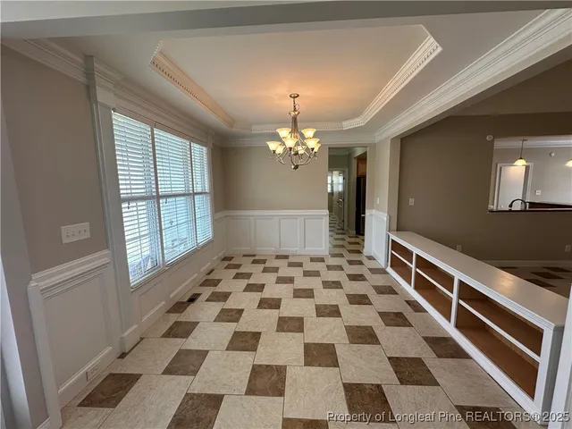 a view of a livingroom with a black and white checkered floor